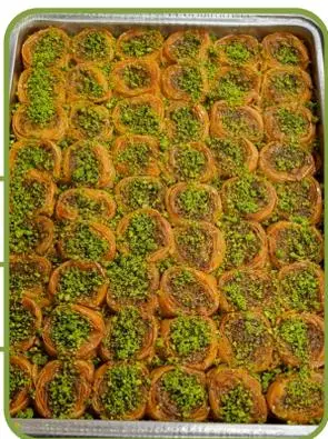 Dana gözü (bull's-eye) baklava rounds topped with pistachio.