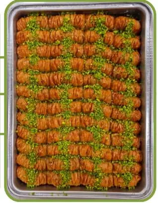 Vezir parmağı — syrup-soaked pastry fingers topped with pistachio.