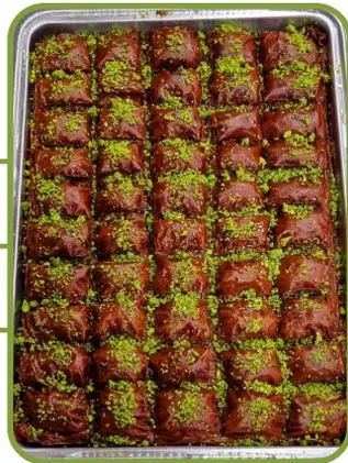 Chocolate baklava topped with pistachio.
