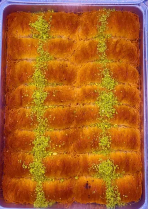 Kunafa with pistachio — shredded kataifi pastry in syrup.