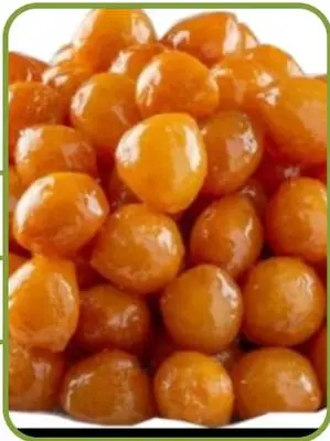 Loqma gazi — small round syrup-soaked fried dough bites.