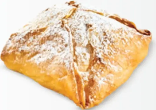 Greek bougatsa — filo pastry filled with semolina custard cream, dusted with sugar.