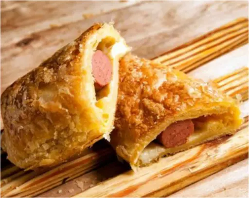Puff pastry wrapped around chicken sausage, ready to bake from frozen.