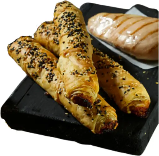 Pastry stick filled with chicken shawarma and tzatziki, ready to bake from frozen.