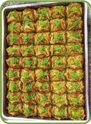 Gelin bohçası — pastry parcels topped with pistachio.