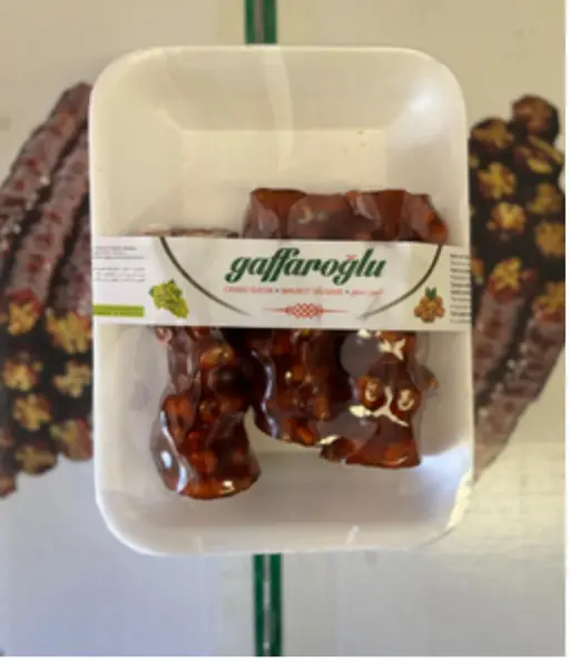 Walnut churchkhela (cevizli sucuk) — walnuts strung and coated in grape must. Gaffaroglu brand.