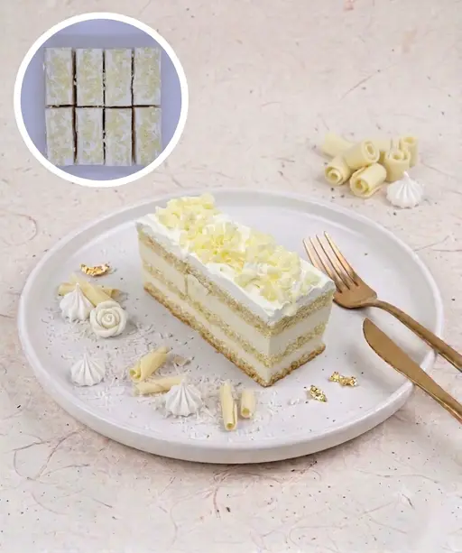 Layered white chocolate slice cake with white frosting.