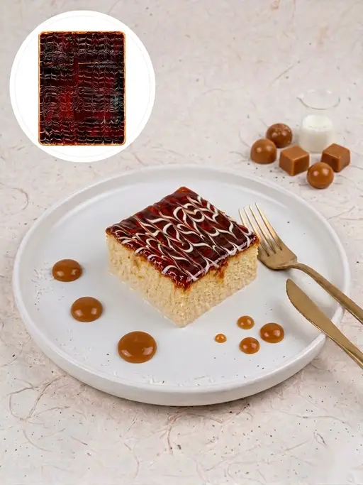 Tres leches (trilece) milk-soaked sponge with a caramelised top.