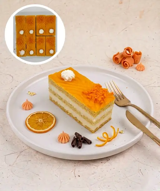 Layered orange-flavoured slice cake with cream.