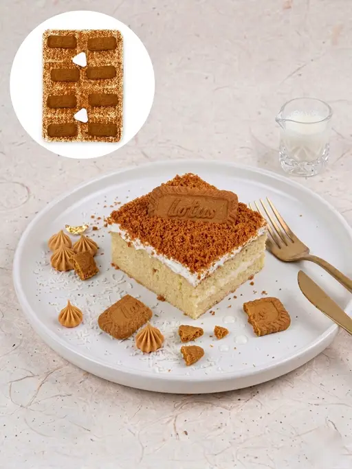 Tres leches (trilece) milk cake with cream, topped with Lotus Biscoff biscuits.
