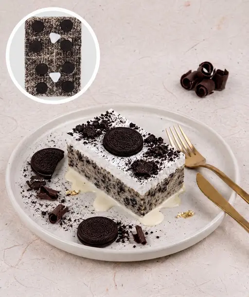 Tres leches (trilece) milk cake topped with cream and crushed Oreo.