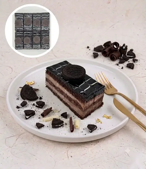 Layered dark chocolate slice cake topped with Oreo.