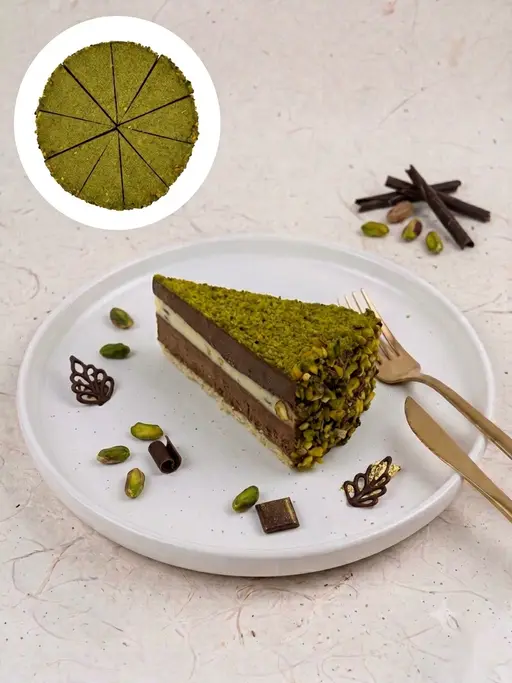 Pistachio cake covered in pistachio frosting.