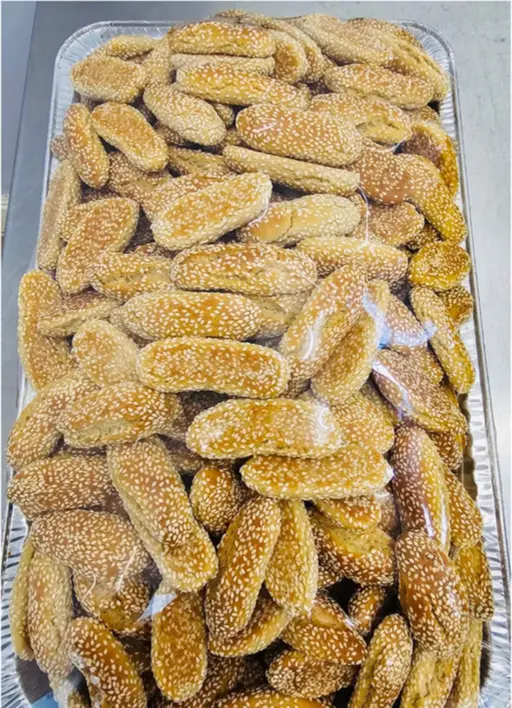 Chorak kulicha — sesame-coated golden bread rolls.