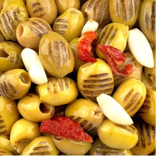 Pitted grilled green olives with garlic and sun-dried tomatoes.