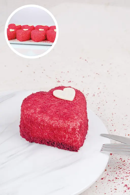 Heart-shaped mono cake with a red glaze.