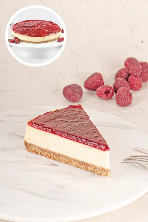 Raspberry cheesecake topped with raspberry glaze and fresh raspberries.