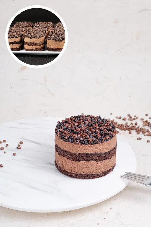 Chocolate mono cake with chocolate cream layers.
